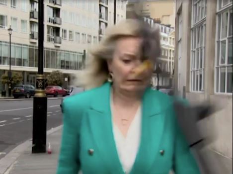 Moment Trade Secretary Liz Truss almost hit on head by falling tripod during live Sky TV interview