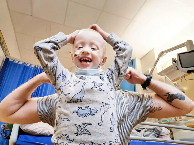 Brave five-year-old boy who overcame Covid and rare cancer spends first day at school with twin brother