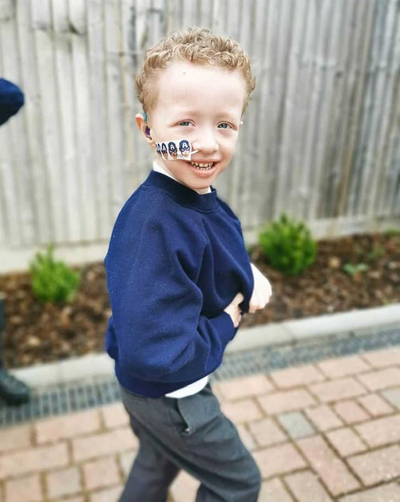 Brave five-year-old boy who overcame Covid and rare cancer spends first day at school with twin brother