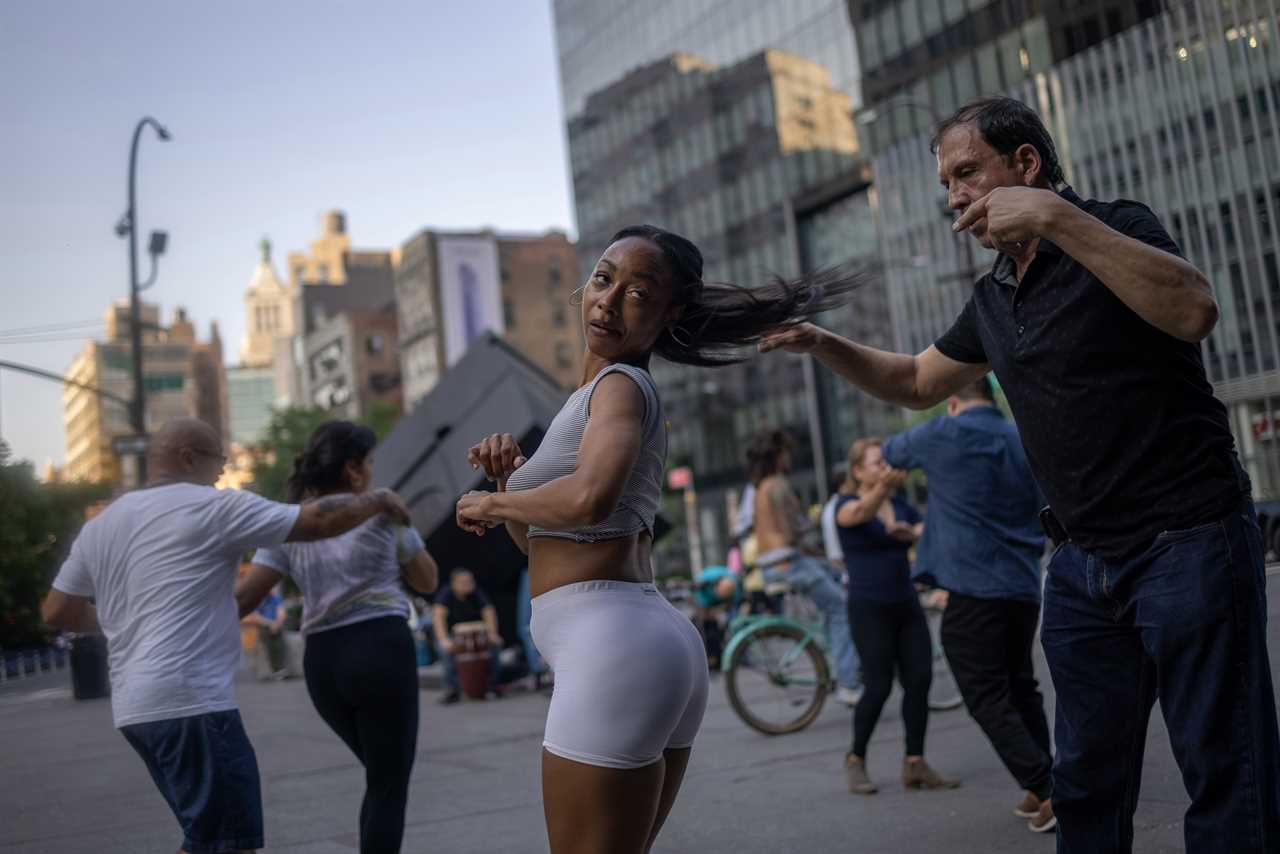 New York roars back to life as city’s bars and restaurants fully reopen and temperatures soar