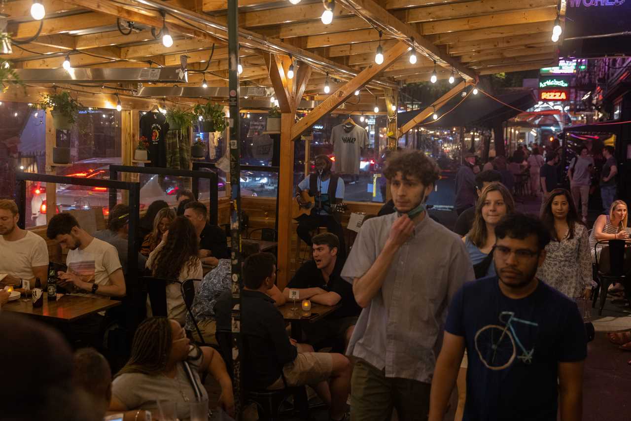 New York roars back to life as city’s bars and restaurants fully reopen and temperatures soar