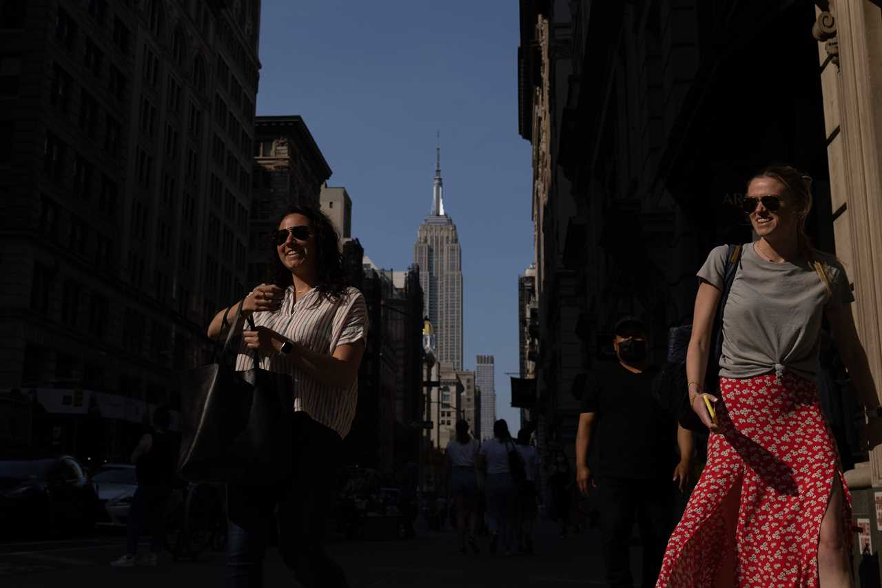 New York roars back to life as city’s bars and restaurants fully reopen and temperatures soar