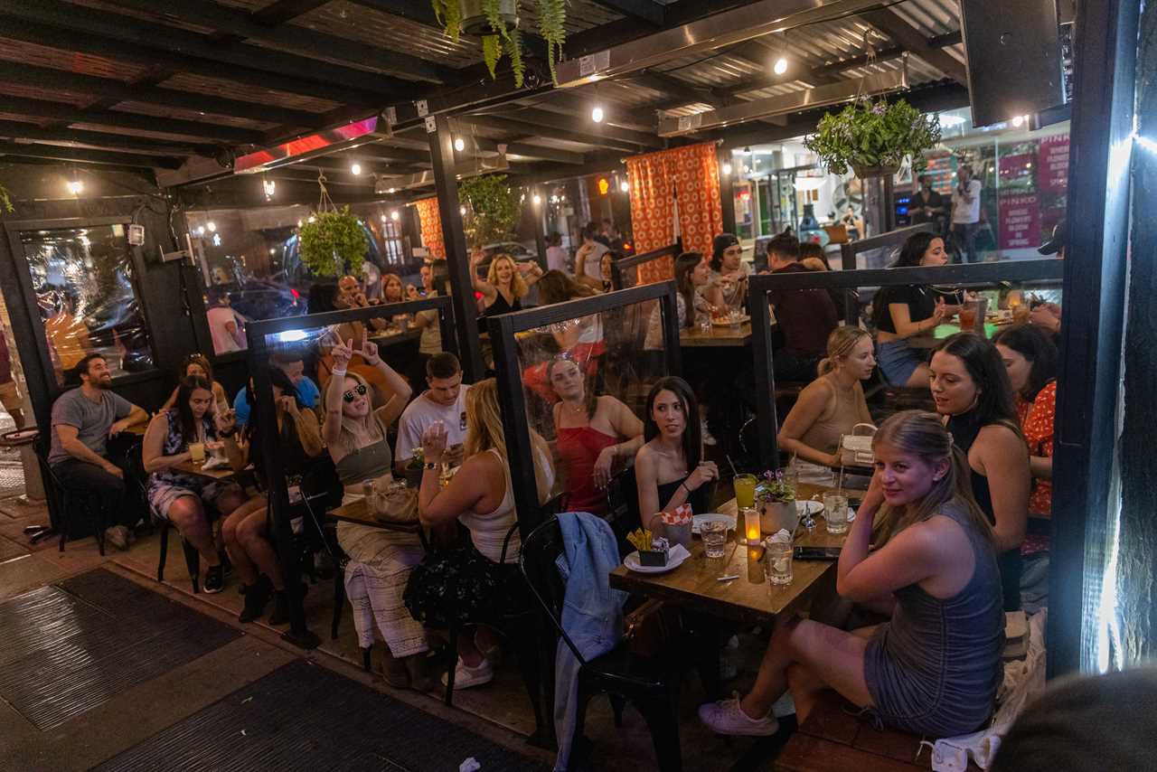 New York roars back to life as city’s bars and restaurants fully reopen and temperatures soar