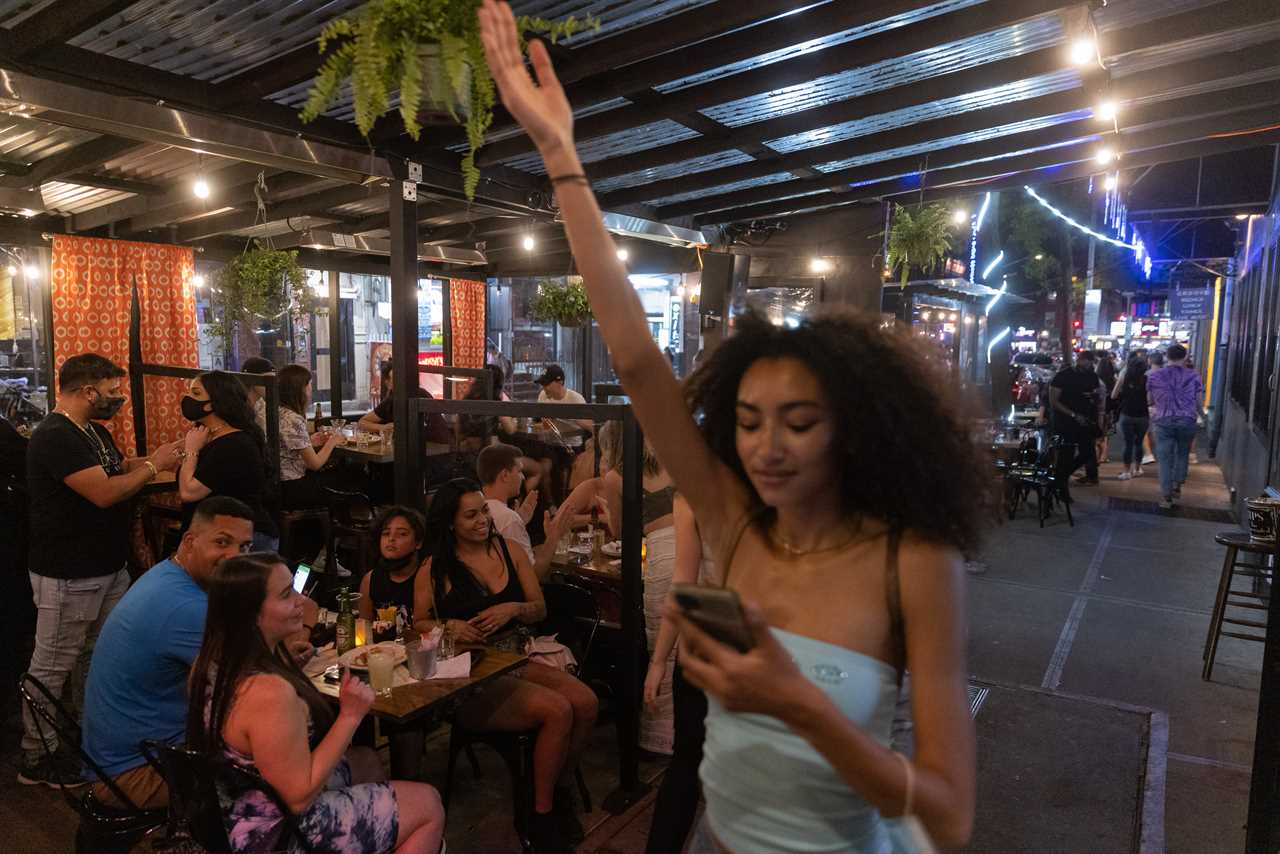 New York roars back to life as city’s bars and restaurants fully reopen and temperatures soar