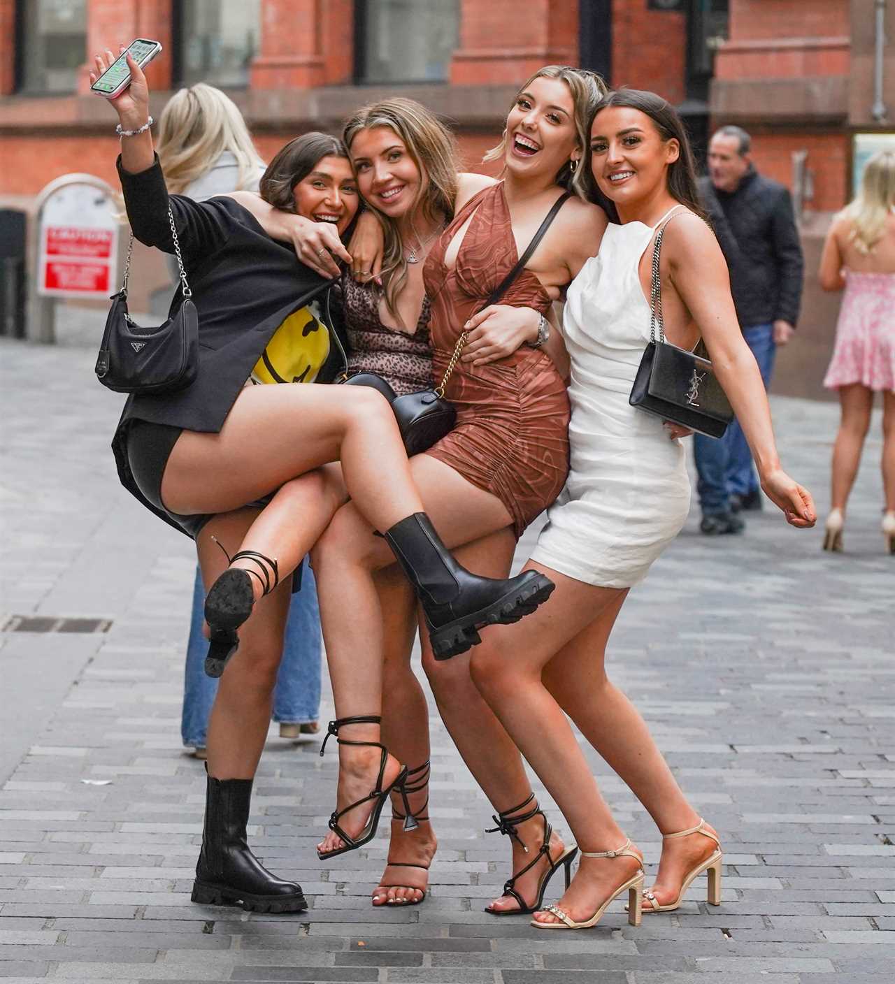 Bank Holiday: Booze-fuelled revellers hit the town for Friday night fun as weekend begins with a bang