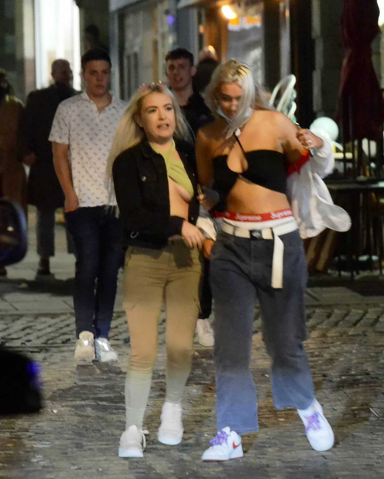 Bank Holiday: Booze-fuelled revellers hit the town for Friday night fun as weekend begins with a bang