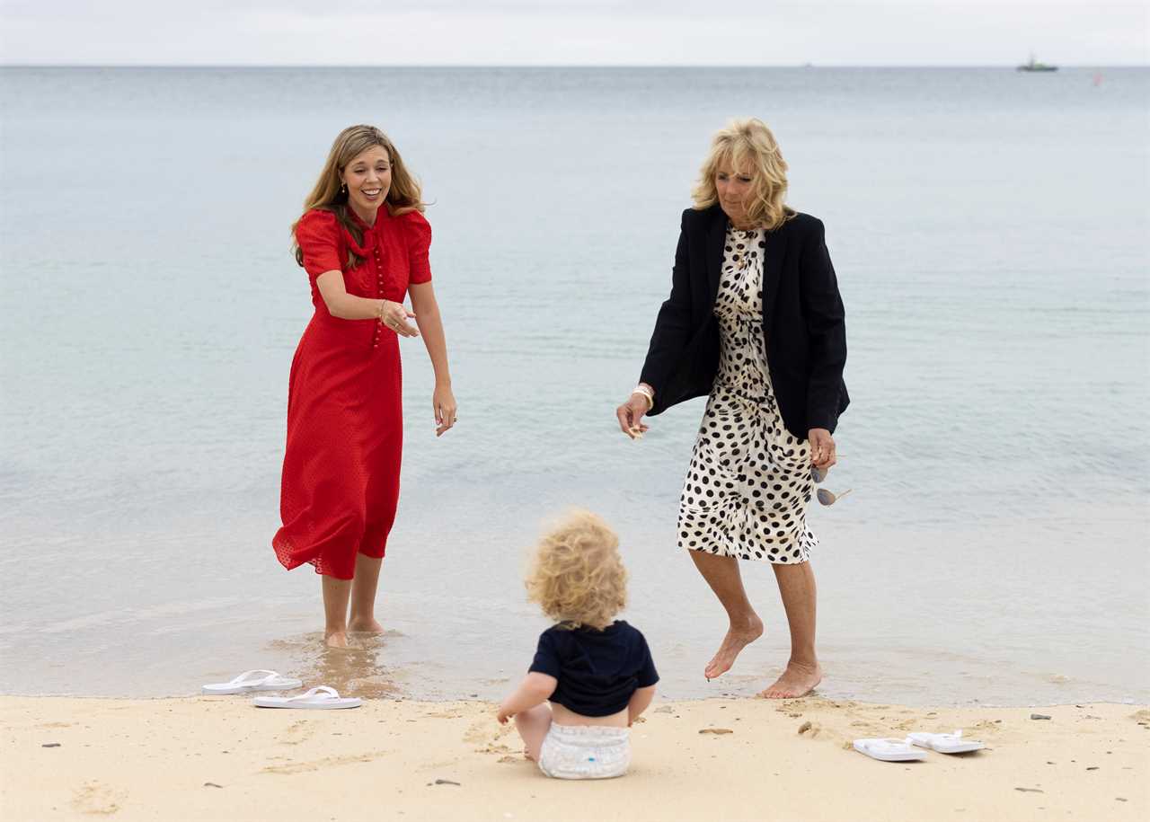 Carrie Symonds plays with son Wilfred as she joins Jill Biden on beach walk