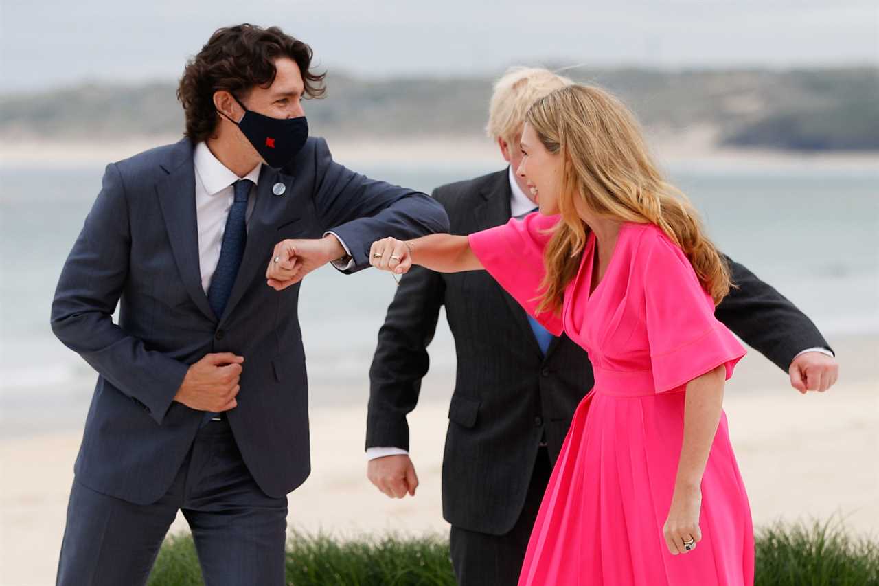 Boris Johnson and Carrie Symonds elbow bump world leaders on G7 beach as Jill Biden jokes it’s ‘like a wedding!’