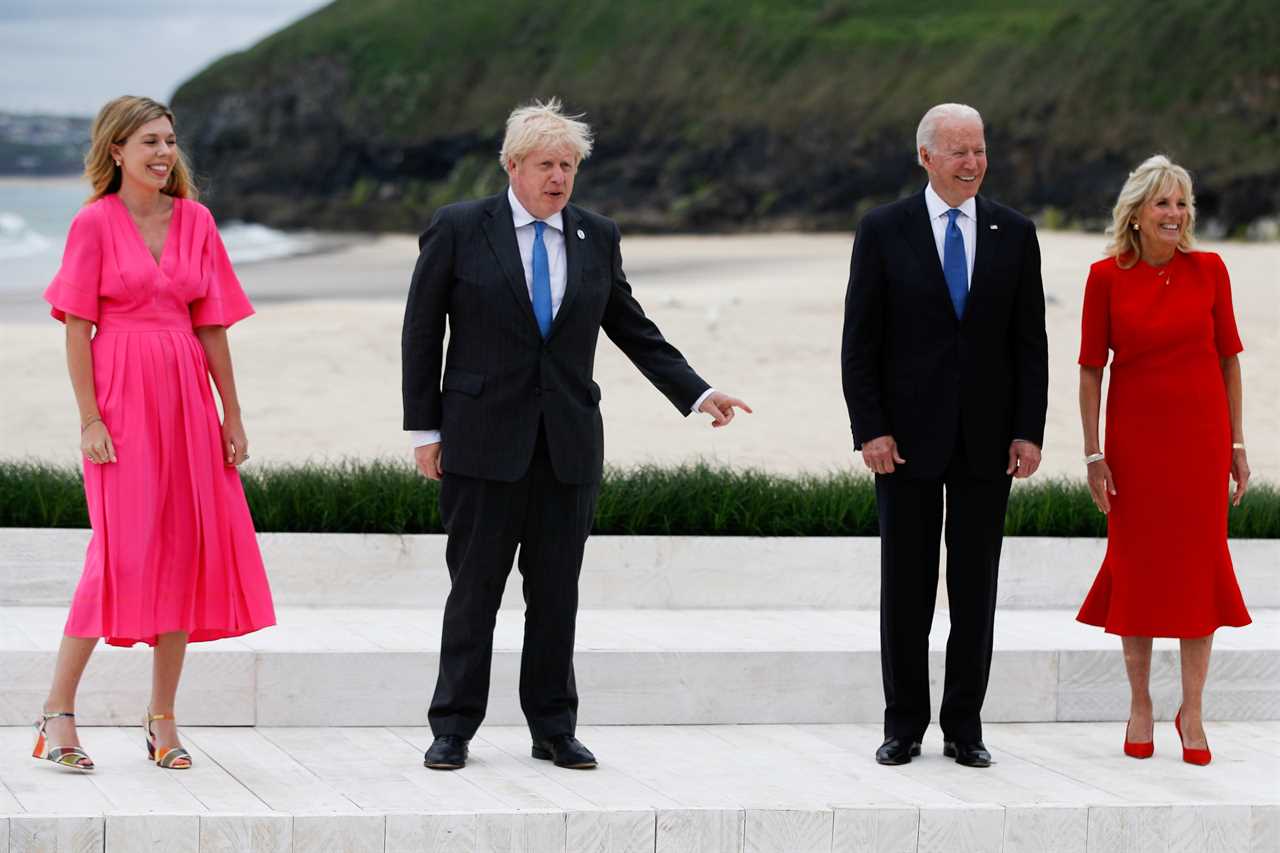 Boris Johnson and Carrie Symonds elbow bump world leaders on G7 beach as Jill Biden jokes it’s ‘like a wedding!’