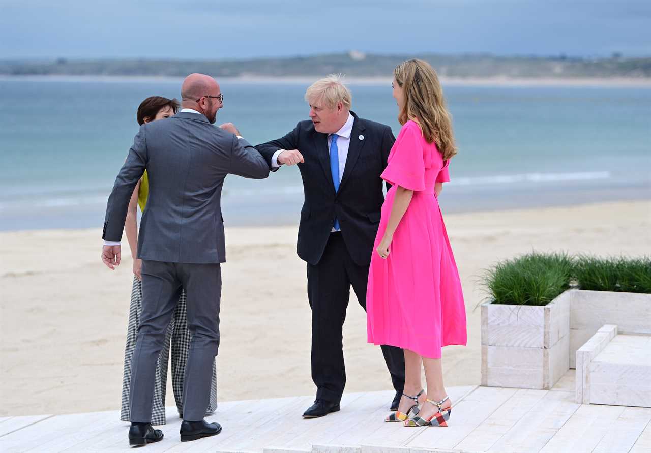 Boris Johnson and Carrie Symonds elbow bump world leaders on G7 beach as Jill Biden jokes it’s ‘like a wedding!’