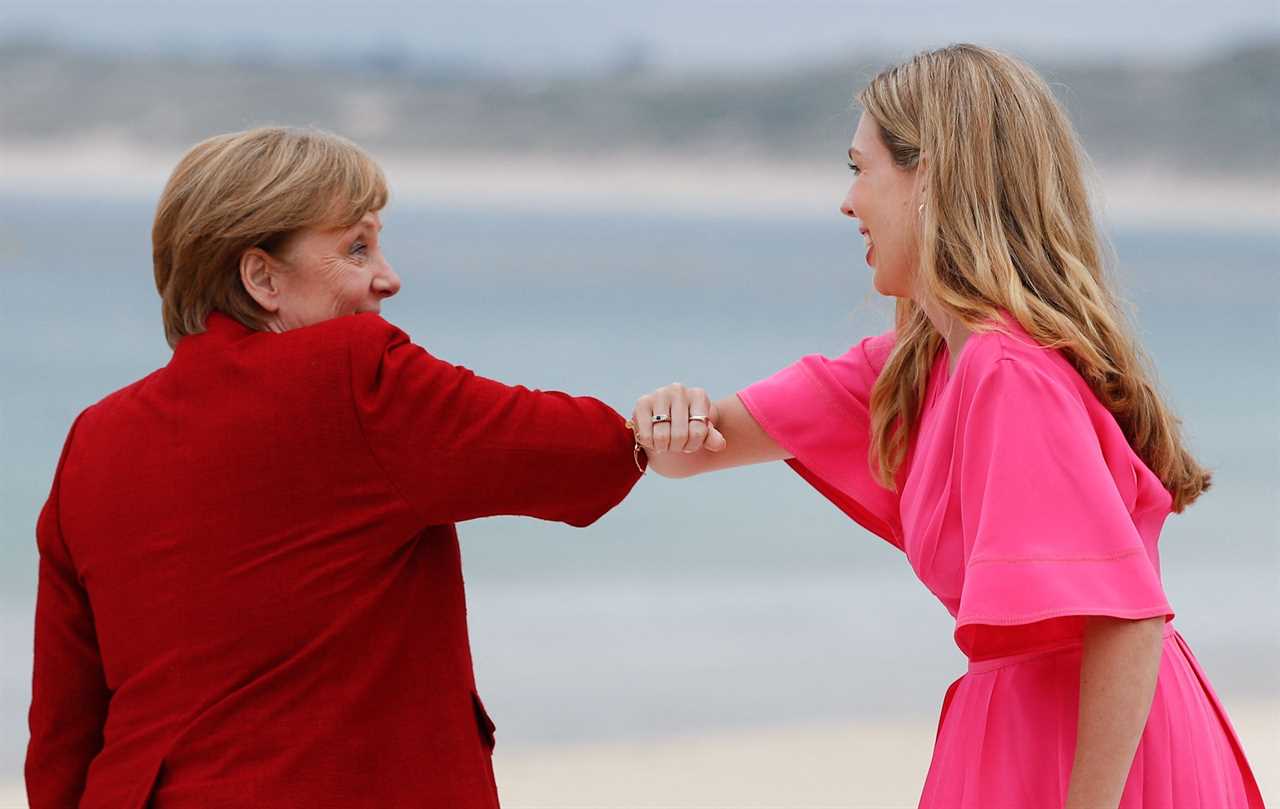 Boris Johnson and Carrie Symonds elbow bump world leaders on G7 beach as Jill Biden jokes it’s ‘like a wedding!’