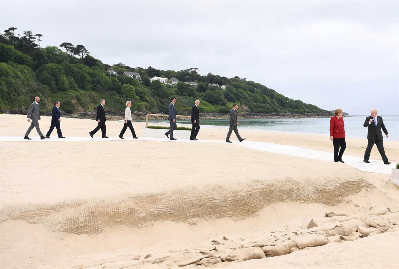 Boris Johnson and Carrie Symonds elbow bump world leaders on G7 beach as Jill Biden jokes it’s ‘like a wedding!’