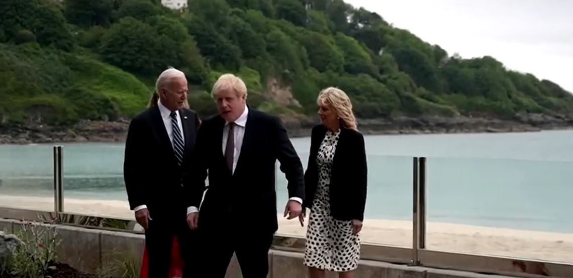 Awkward moment Boris Johnson almost holds hands with Joe Biden’s wife Jill as new wife Carrie lingers in the background