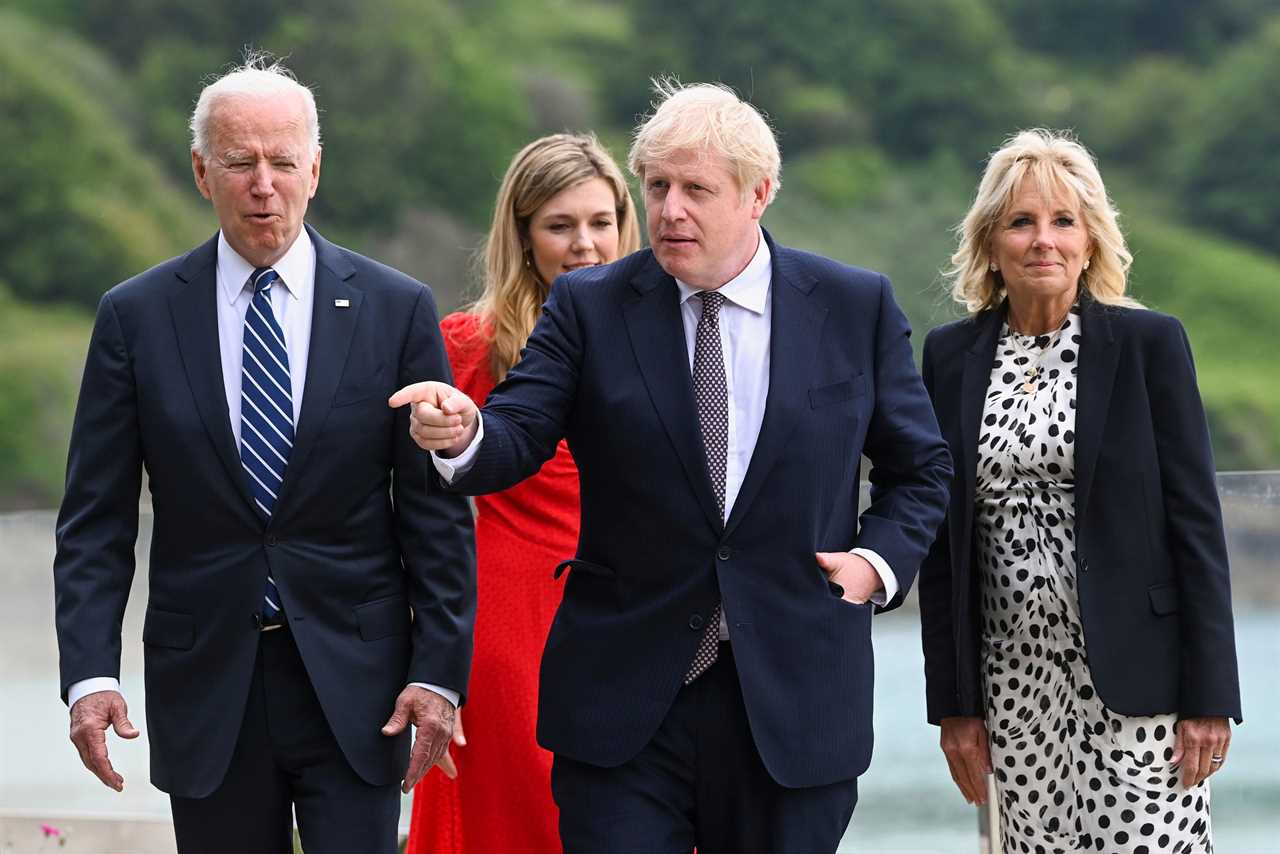 Awkward moment Boris Johnson almost holds hands with Joe Biden’s wife Jill as new wife Carrie lingers in the background