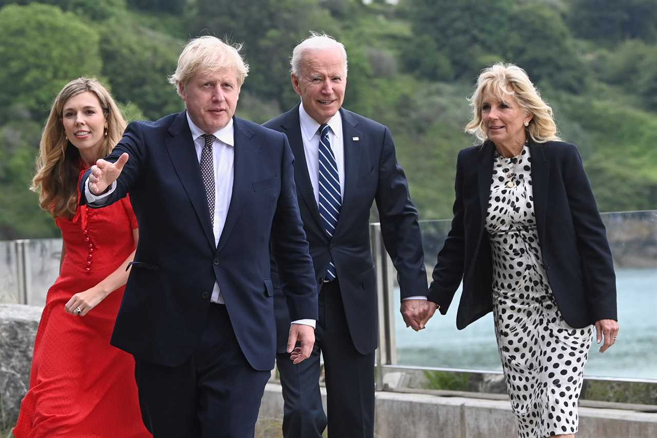 Awkward moment Boris Johnson almost holds hands with Joe Biden’s wife Jill as new wife Carrie lingers in the background