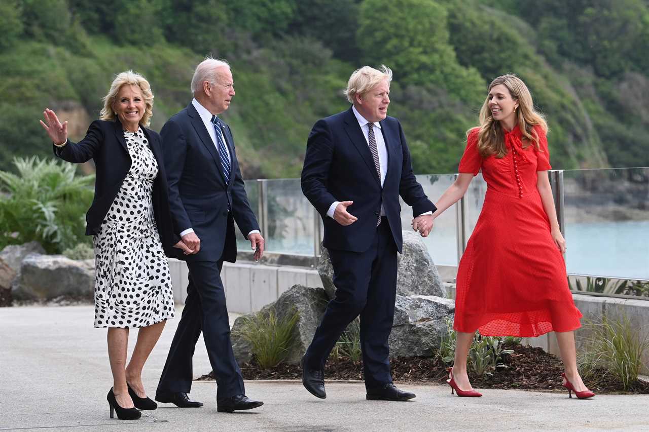 Awkward moment Boris Johnson almost holds hands with Joe Biden’s wife Jill as new wife Carrie lingers in the background