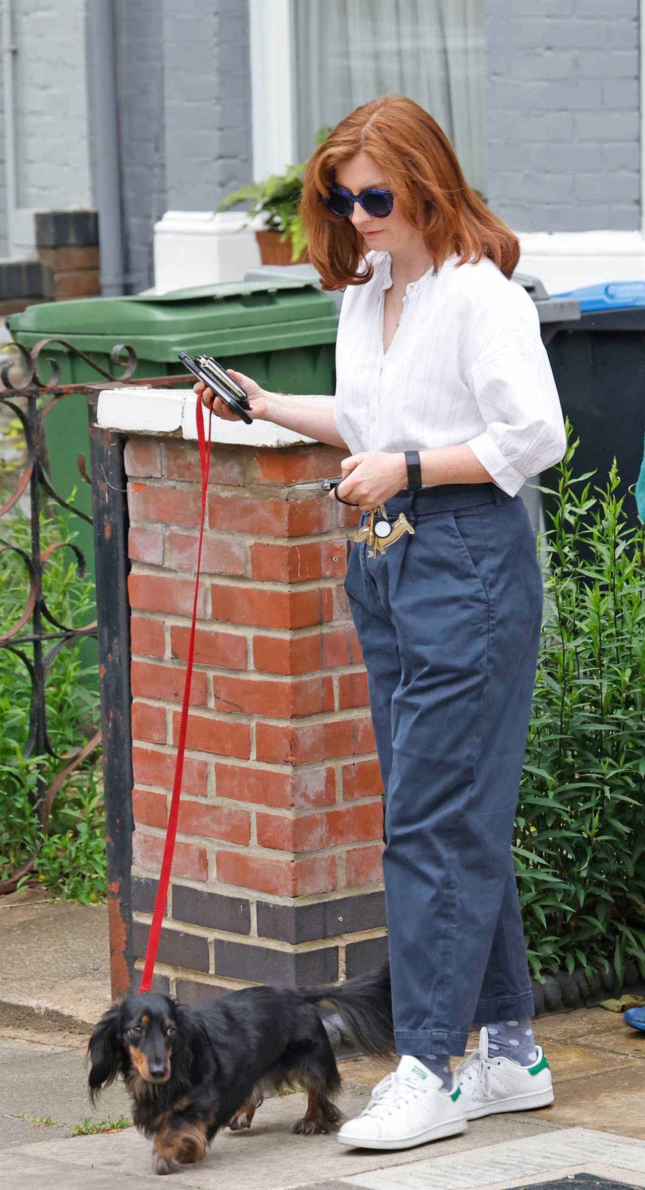 Mr Hancock's wife Martha Hoyer Millar leaves her house this morning