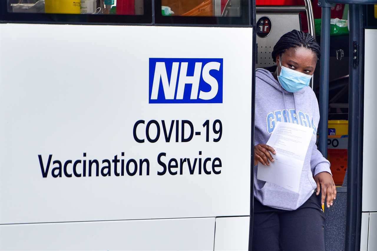 Hundreds queue outside Covid vaccine centres as they open their doors to walk-in patients