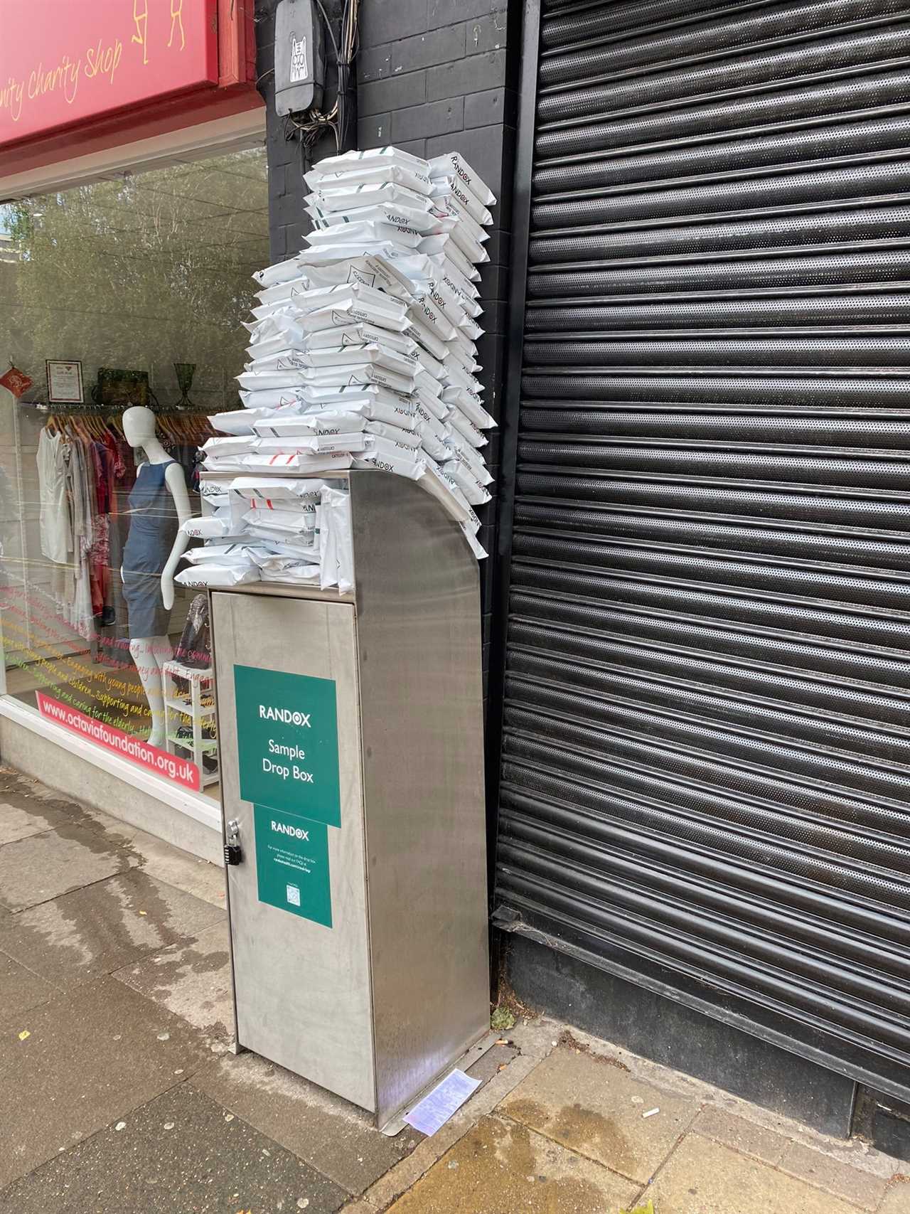 An over-flowing Randox drop box