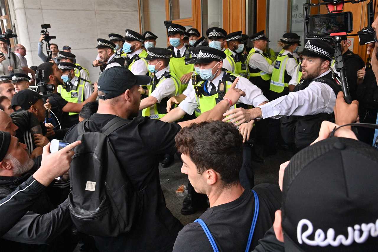 Anti-vaccine mob clashes with cops as they try to storm medicine watchdog building over jabs