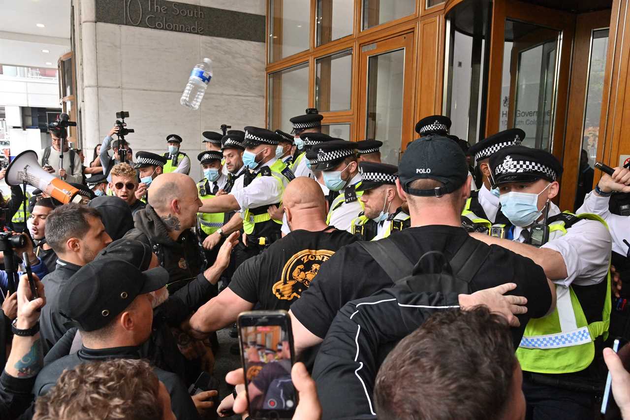 Anti-vaccine mob clashes with cops as they try to storm medicine watchdog building over jabs