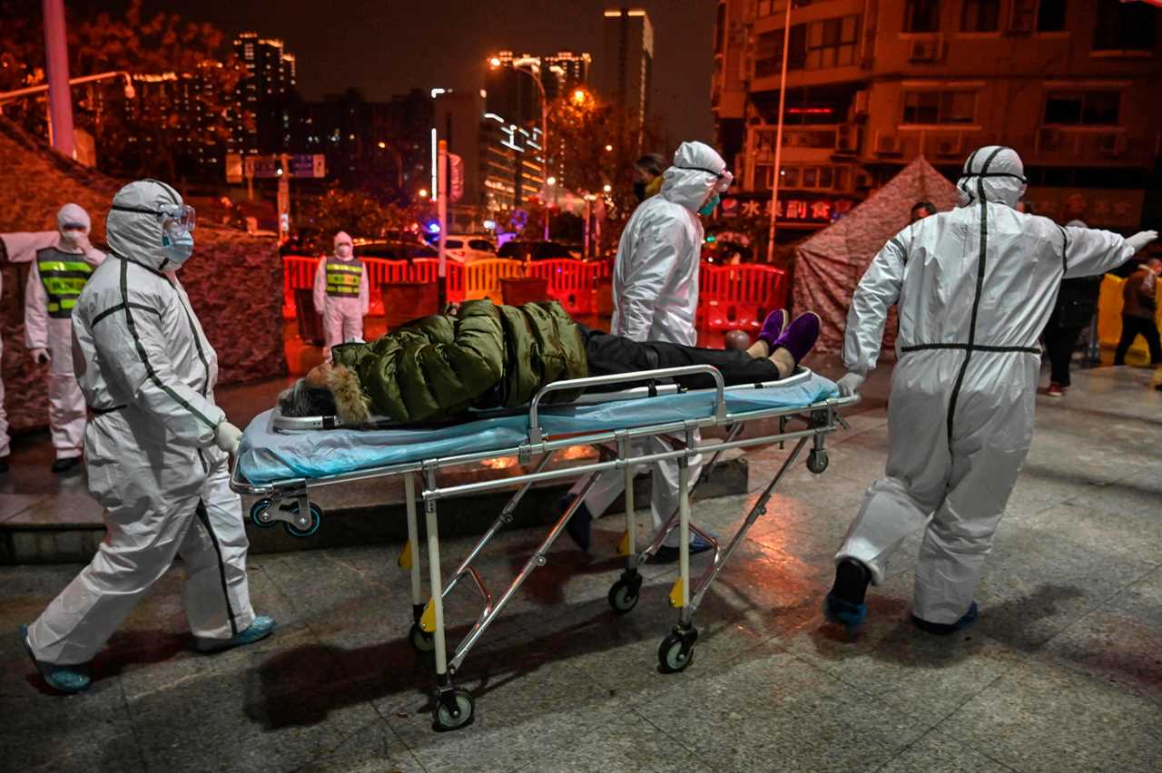 Medical staff members wearing protective clothing to help stop the spread of a deadly virus which began in the city of Wuhan