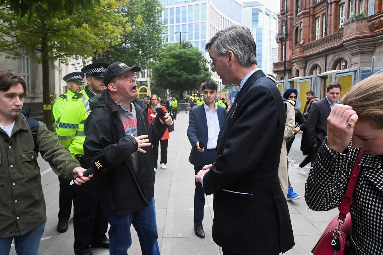 Jacob Rees-Mogg chased by shameless protesters shouting ‘scum’ and booing him outside Tory conference