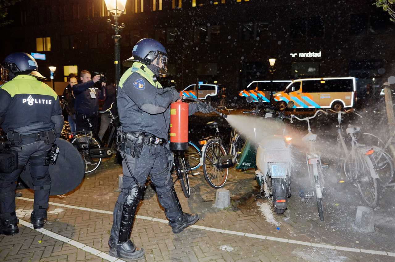 Dutch protesters blasted with water cannons by riot cops as lockdown returns amid Covid surge across Europe