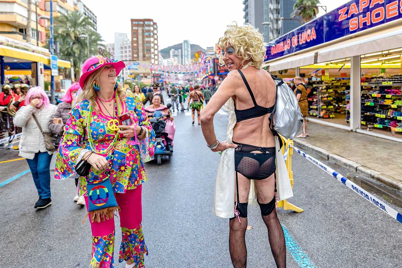 Benidorm’s fancy dress party sees up to 20,000 boozy Brits shrug off Covid fears as they hit resort bars