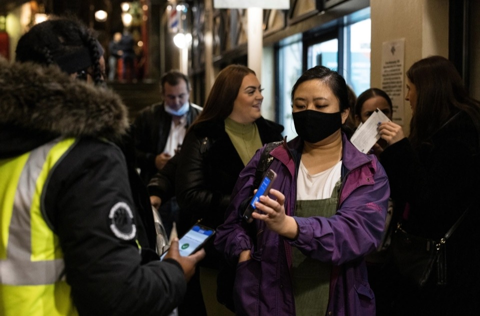 Brits show vaccine passports as they hit the town on first day of new Covid restrictions