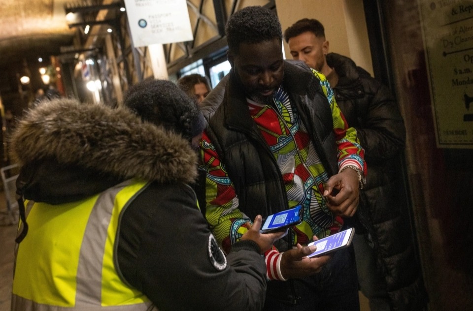 Brits show vaccine passports as they hit the town on first day of new Covid restrictions