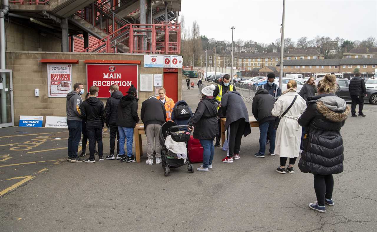 Thousands receive jabs at football stadiums as Omicron causes game cancellations