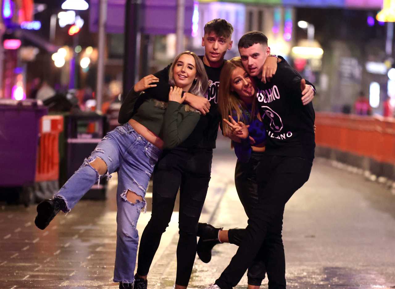 Christmas Eve revellers put Omicron fears aside to hit bars and clubs for festive knees up