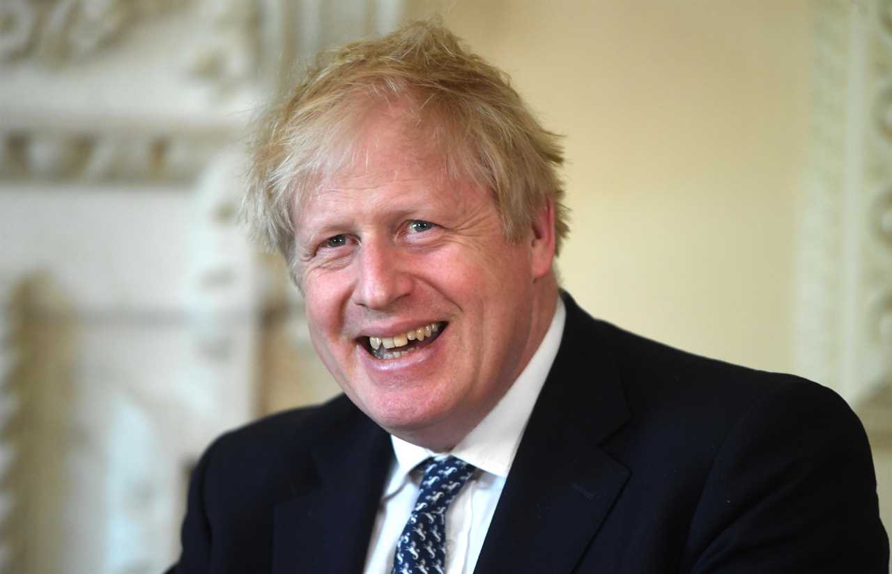 Britain can ‘ride out’ the Omicron wave without any new curbs amid record 218,000 cases, says Boris Johnson