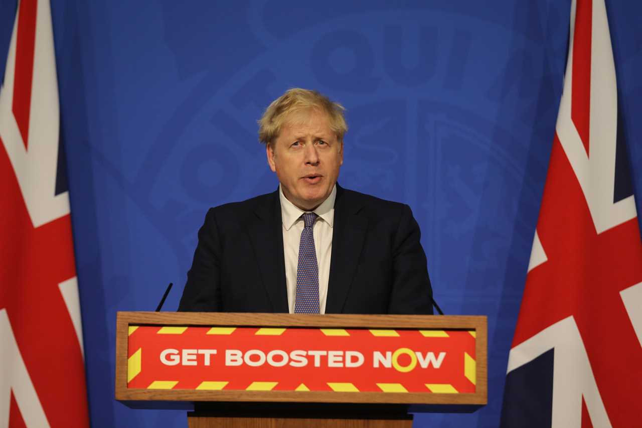 Britain can ‘ride out’ the Omicron wave without any new curbs amid record 218,000 cases, says Boris Johnson