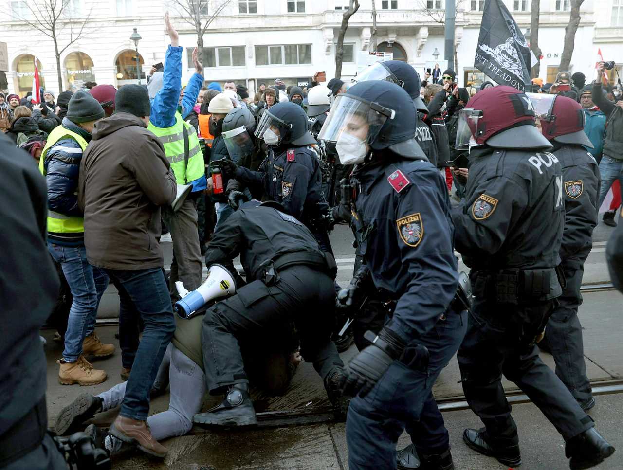 Cops clash with anti-vaccine passport protesters across Europe as countries tighten rules to fight Omicron wave