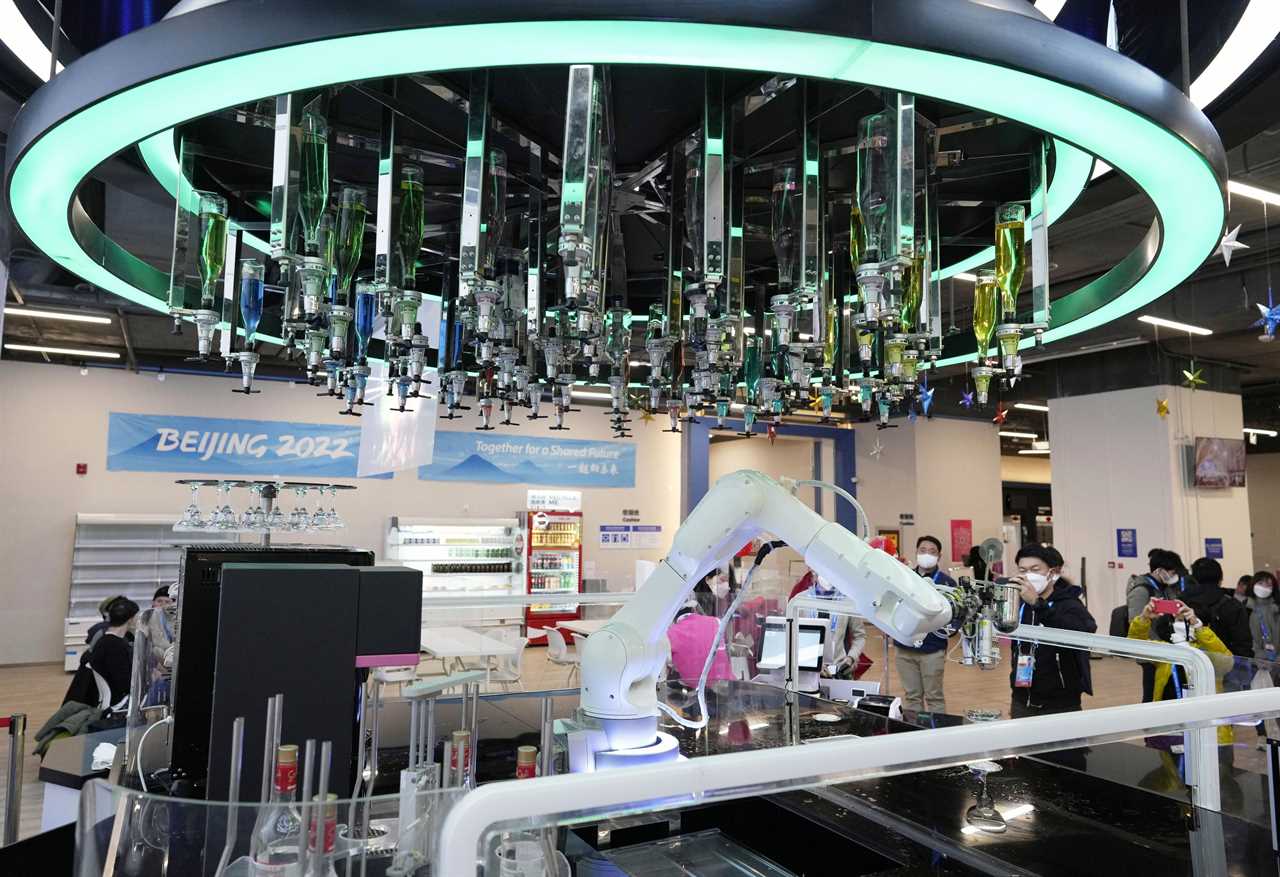 Robots deliver food from ceiling and mix cocktails at 2022 Winter Olympics as part of Beijing’s strict Covid measures