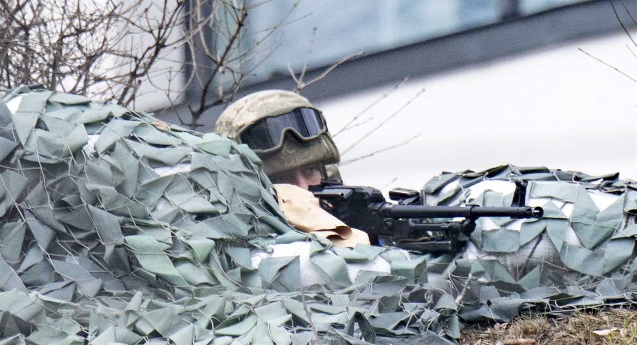 Ukrainian soldiers repel savage attack from Putin’s forces to defend vital road junction