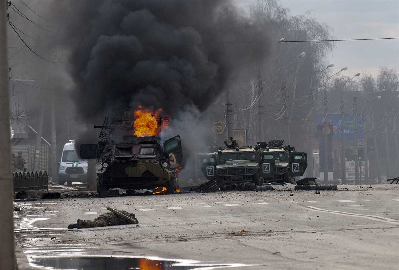 An military truck burns after being abandoned following fighting in Kharkiv, Ukraine