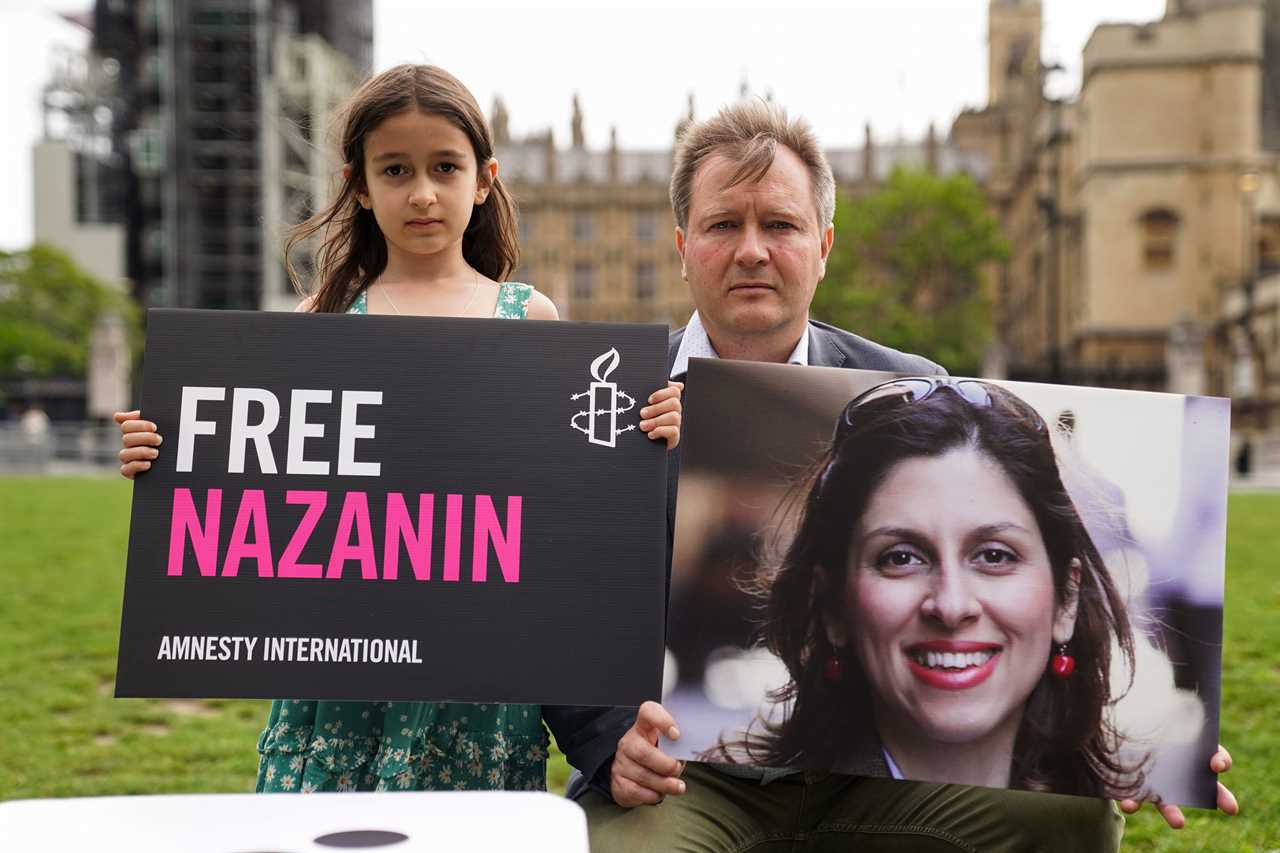 Nazanin Zaghari-Ratcliffe beams from safety of the skies as she heads home to Britain after six years in Iranian jail