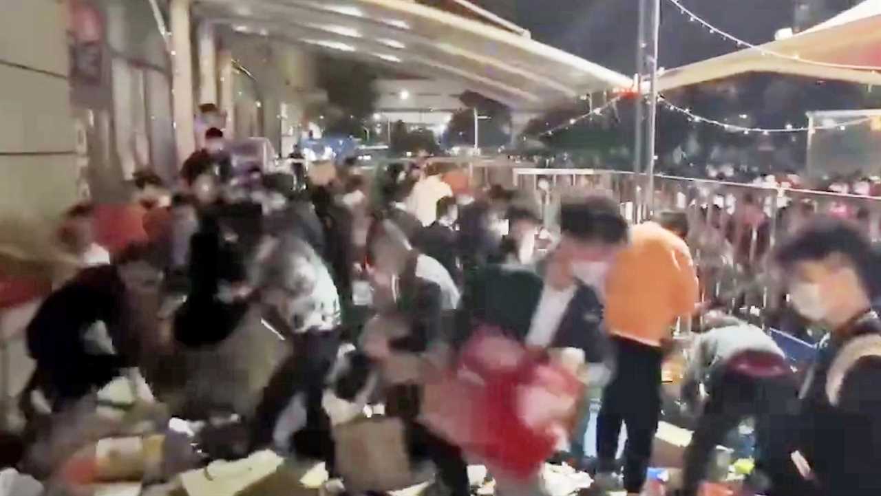 Moment starving Shanghai residents break through cordon to get at supplies amid world’s strictest lockdown