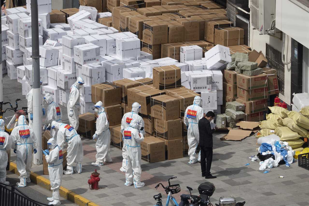 Moment starving Shanghai residents break through cordon to get at supplies amid world’s strictest lockdown