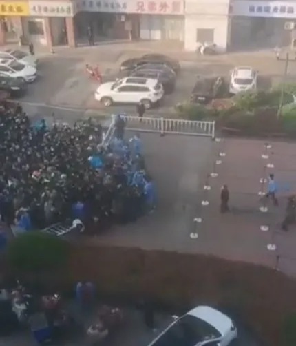 Desperate residents have been filmed breaking through a barricade