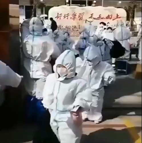 Unsettling footage shows children in Shanghai wearing HAZMAT SUITS on way to school amid bonkers zero Covid regime