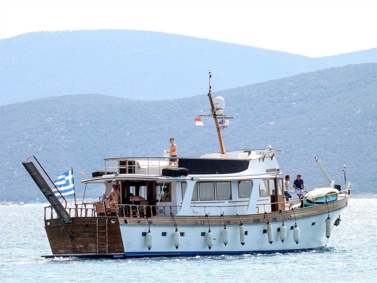 Topless Boris Johnson soaks up the sun with wife Carrie on Greece boat trip