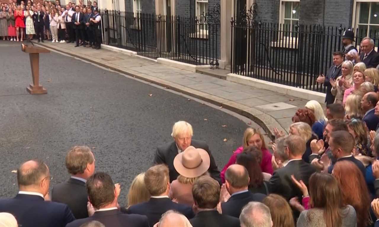 Doting Carrie Johnson holds hands with Boris as he makes final speech outside Downing Street