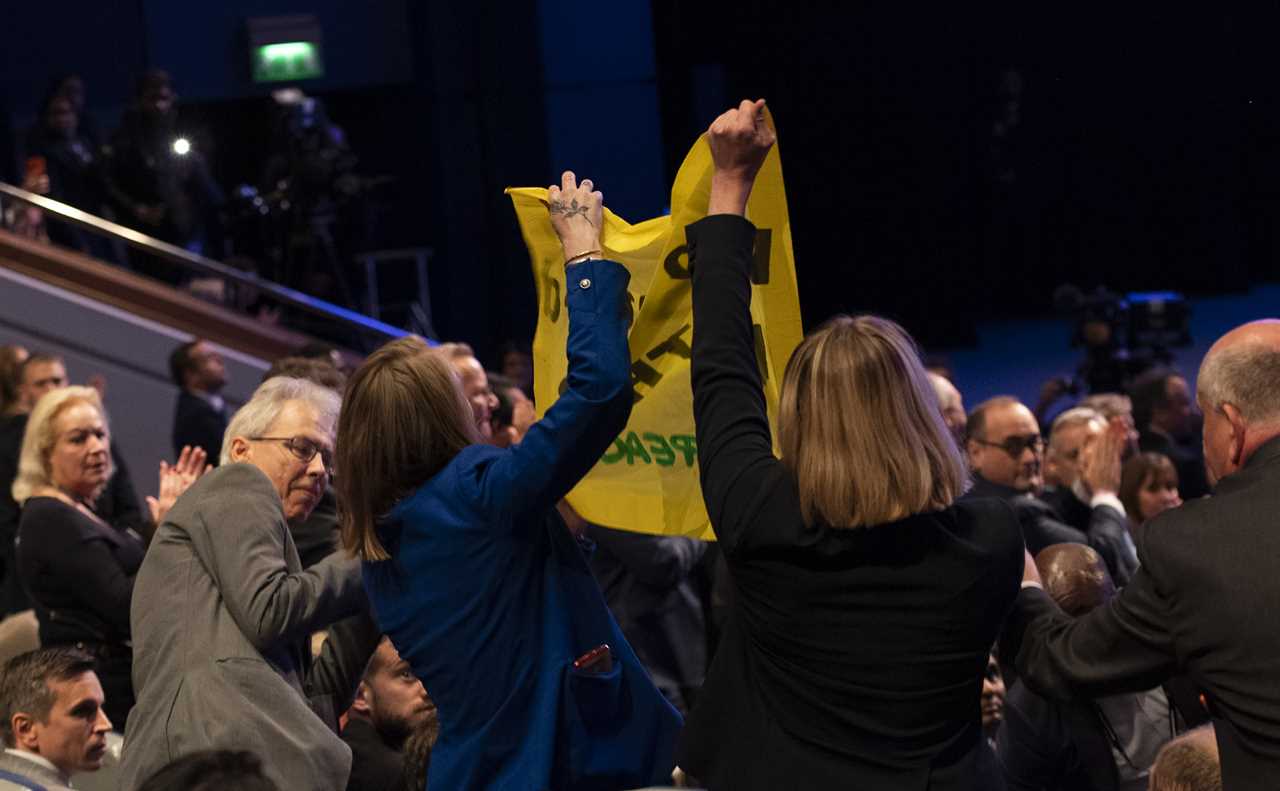 Eco activists ejected from the hall after interrupting Liz Truss’s conference speech