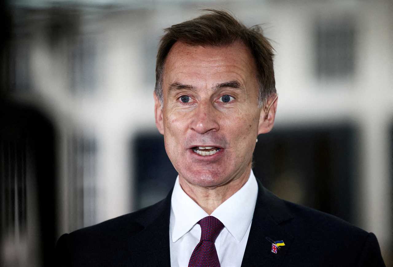 FILE PHOTO: British Chancellor of the Exchequer Jeremy Hunt talks to a television crew outside the BBC headquarters in London, Britain November 18, 2022. REUTERS/Henry Nicholls/File Photo