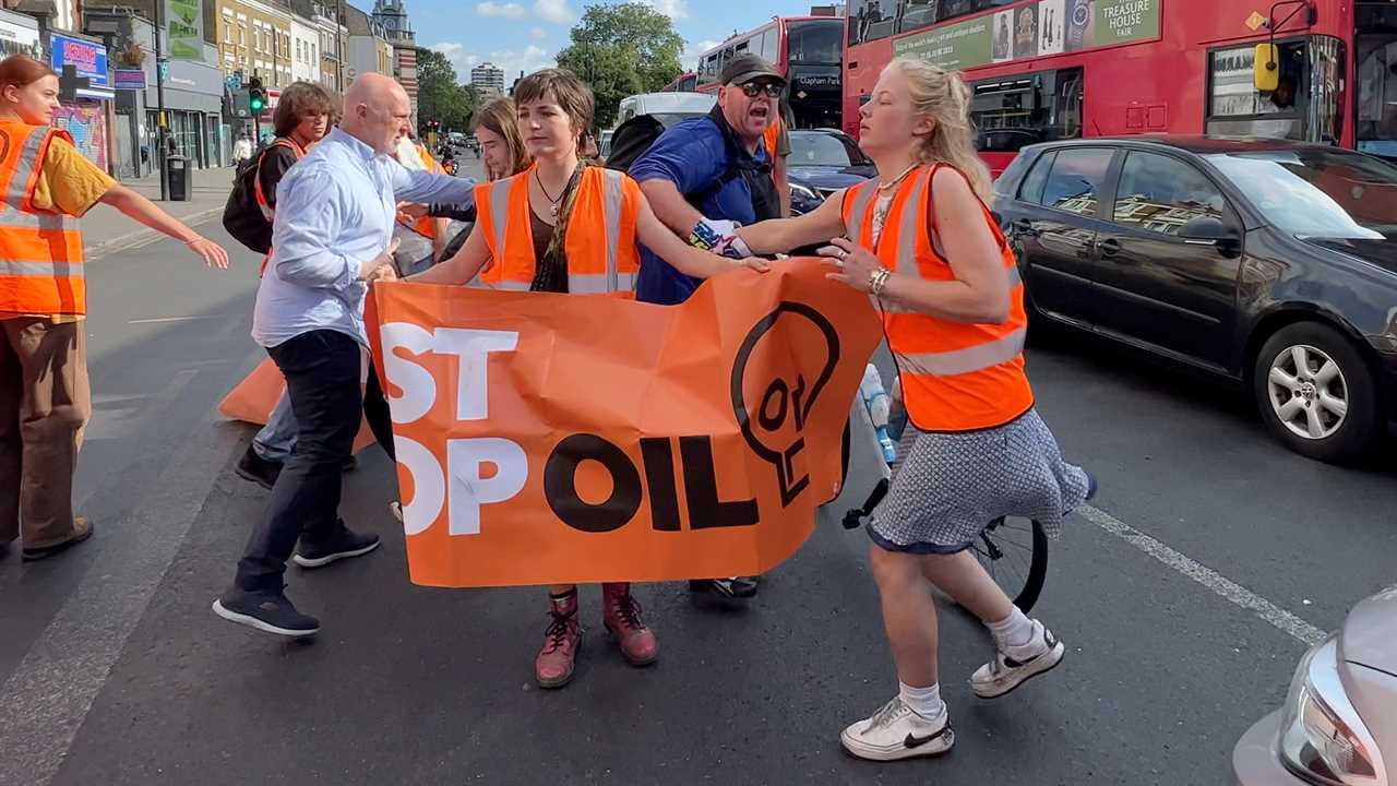 UNITED KINGDOM, LONDON, 26th June 2023 Just Stop Oil continue their Protest Angry men try to push female protesters from the road. Activists from climate group Just Stop Oil continue their daily protests bringing traffic to a standstill in Camberwell. They are calling for the Government to stop issuing new oil and gas licenses. ¿2023 Tom Bowles +44 7956 938547