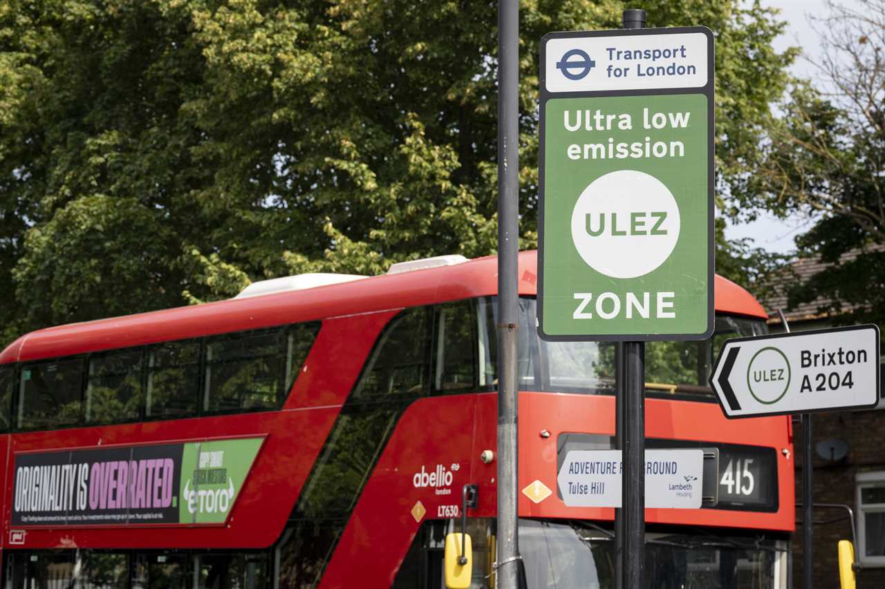 A local bus passes an ULEZ (Ultra Low Emission Zone) sign on the South Circular at Tulse Hill, on 21st July 2023, in London, England. Introduced by his Conservative predecessor Boris Johnson, London Mayor Sadiq Khan wants to expand the ULEZ area to a wider London to older vehicles such as polluting diesels and petrol cars, a controversial air quality policy to lower poisonous emissions that harms the health of 1 in 10 children. Drivers of non-exempt vehicles may enter the ULEZ after paying a £12.50 daily fee - or face a £160 penalty. (Photo by Richard Baker / In Pictures via Getty Images)